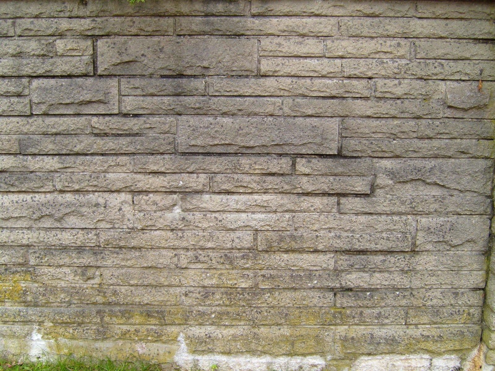 Old grey concrete brick wall