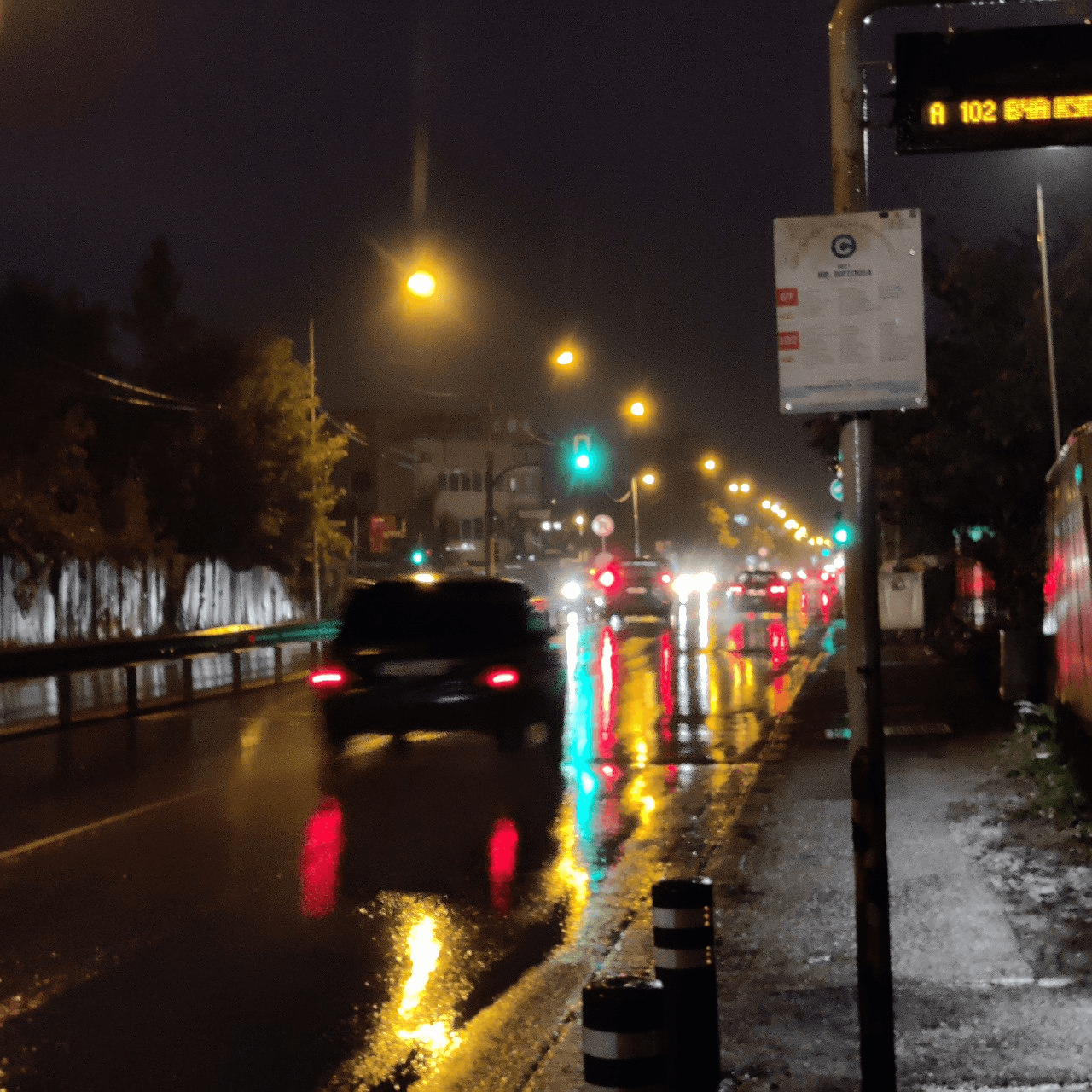 Waiting at bus stop at night
