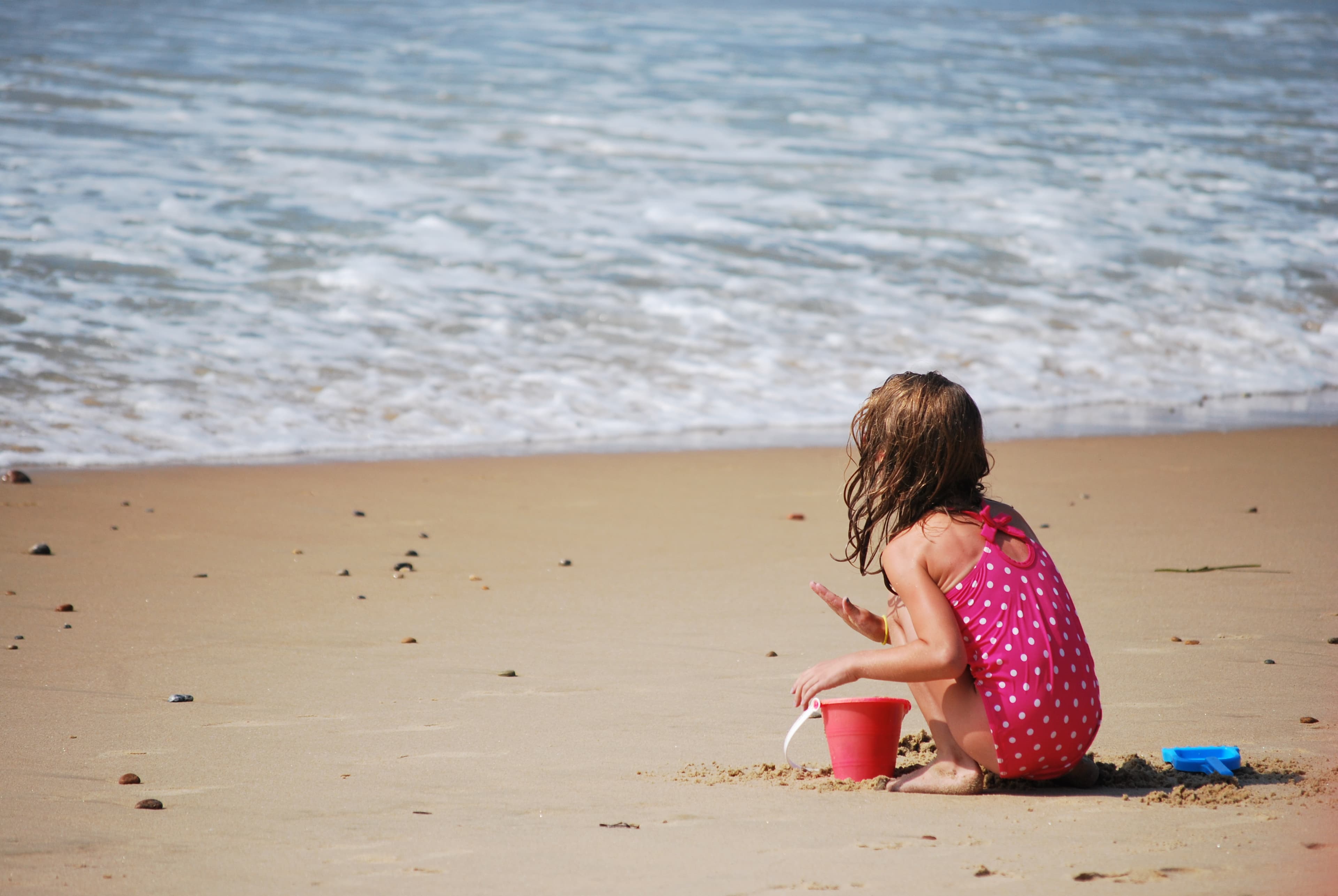 Child playing in the sand at Misquamicut Beach