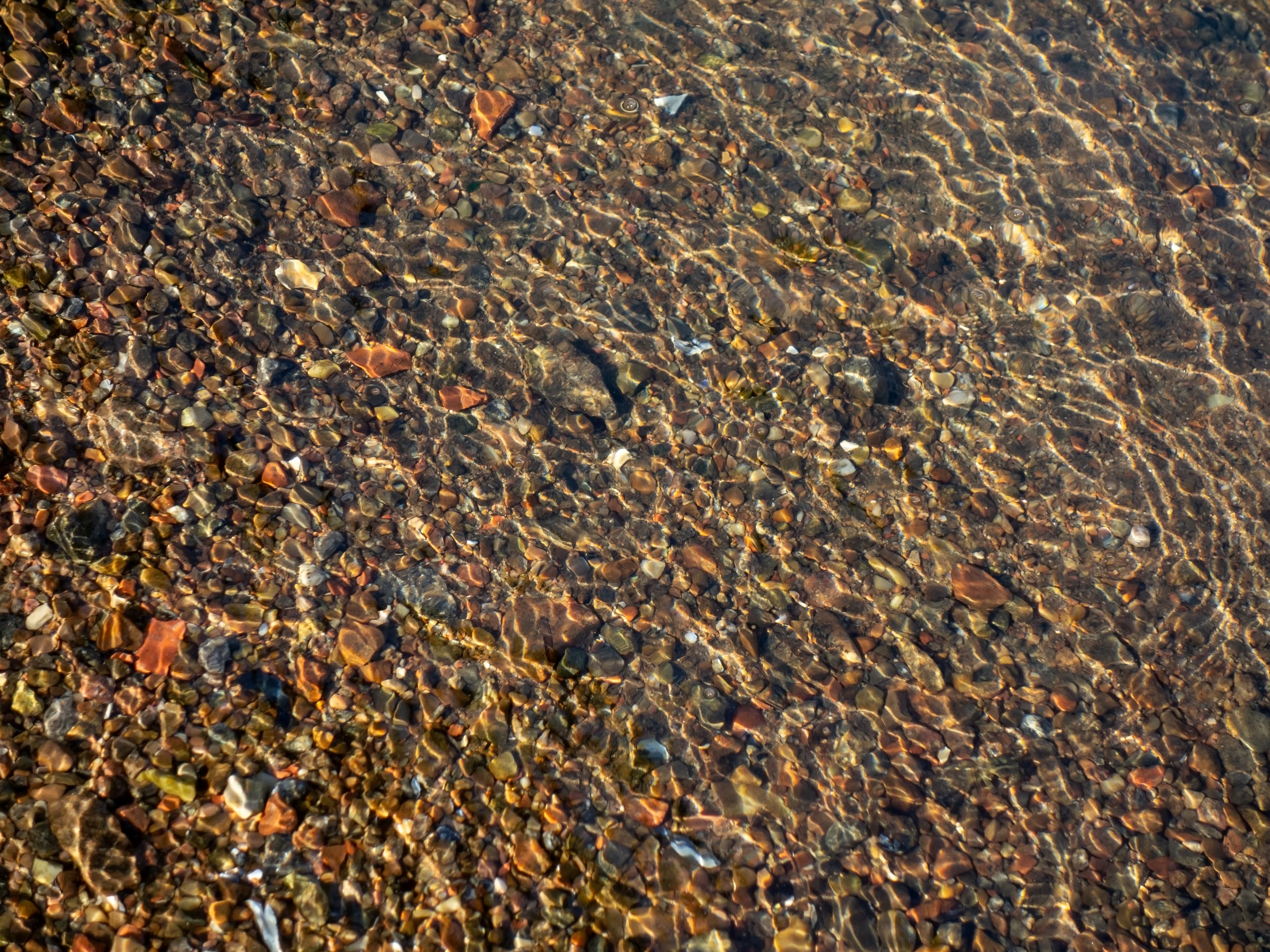 Granite gravel in shallow water 2