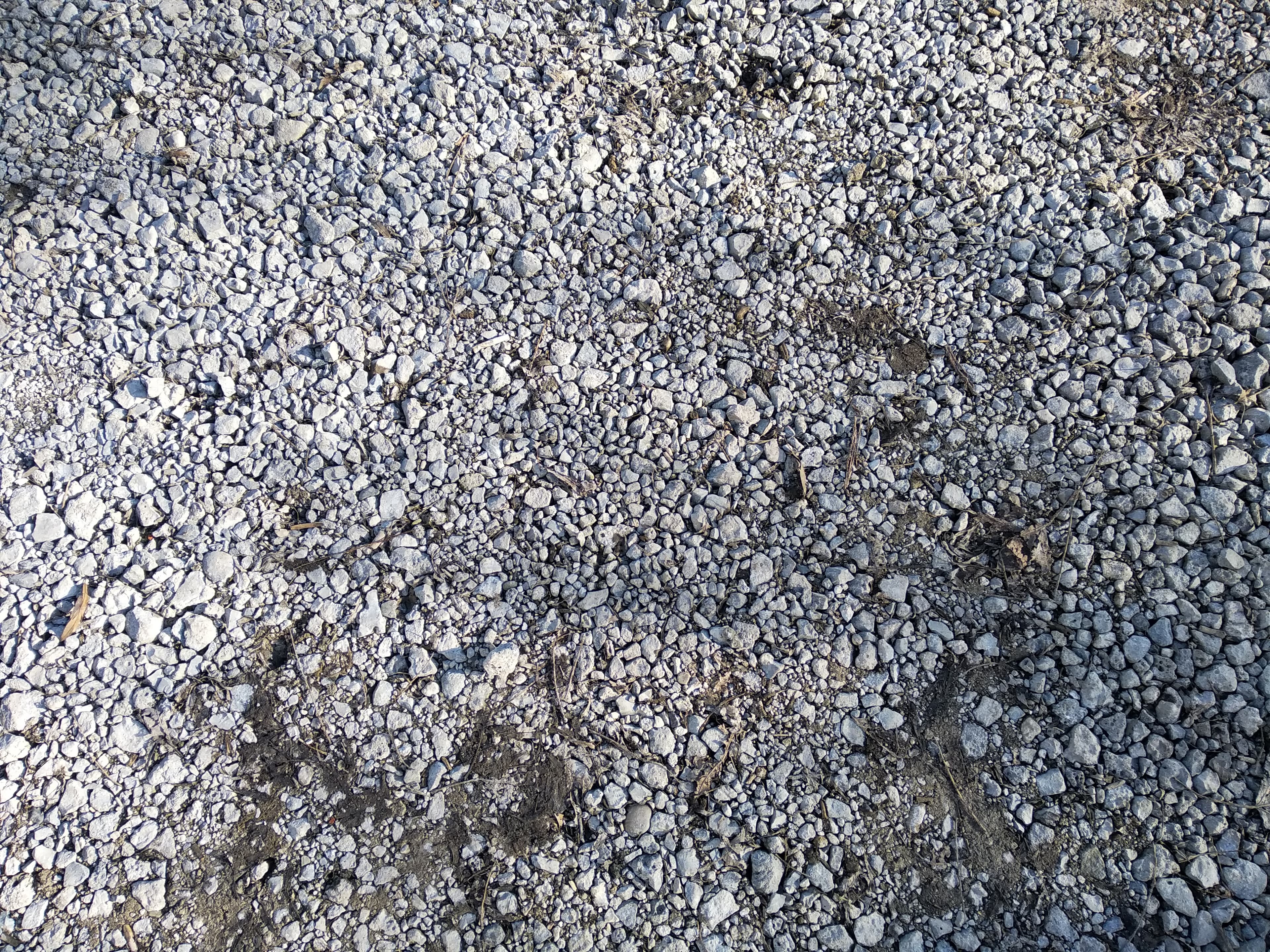 Gravel road with loose gravel closeup