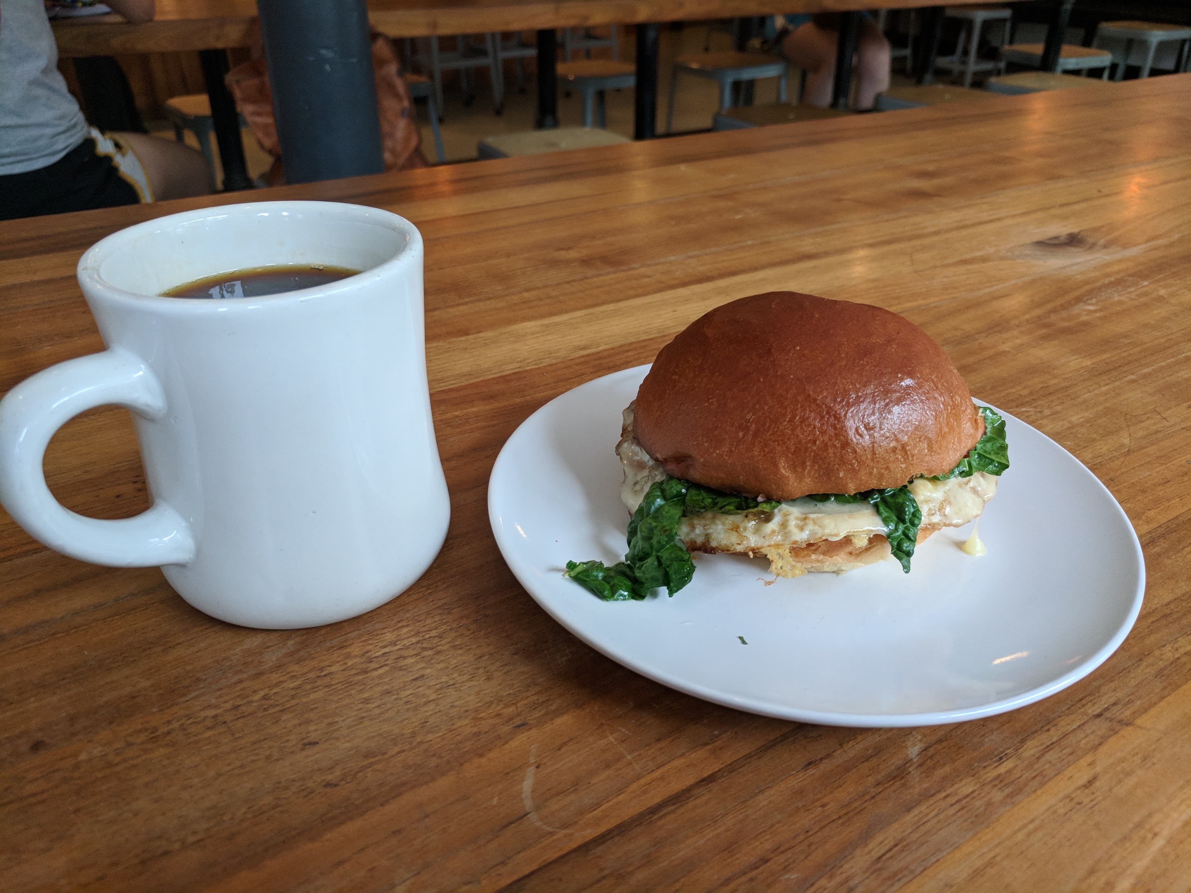 Coffee and breakfast sandwich