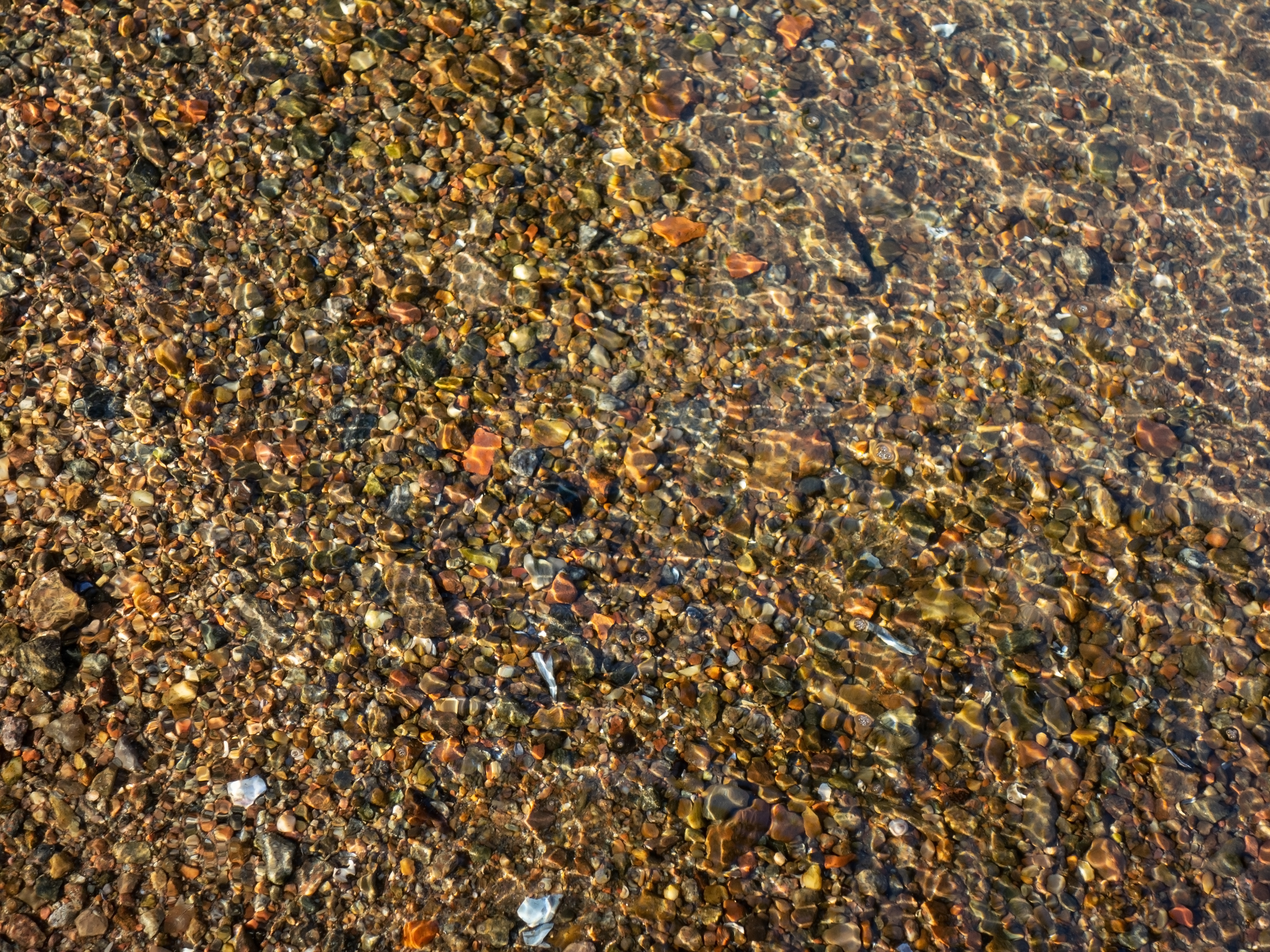 Granite gravel in shallow water 1