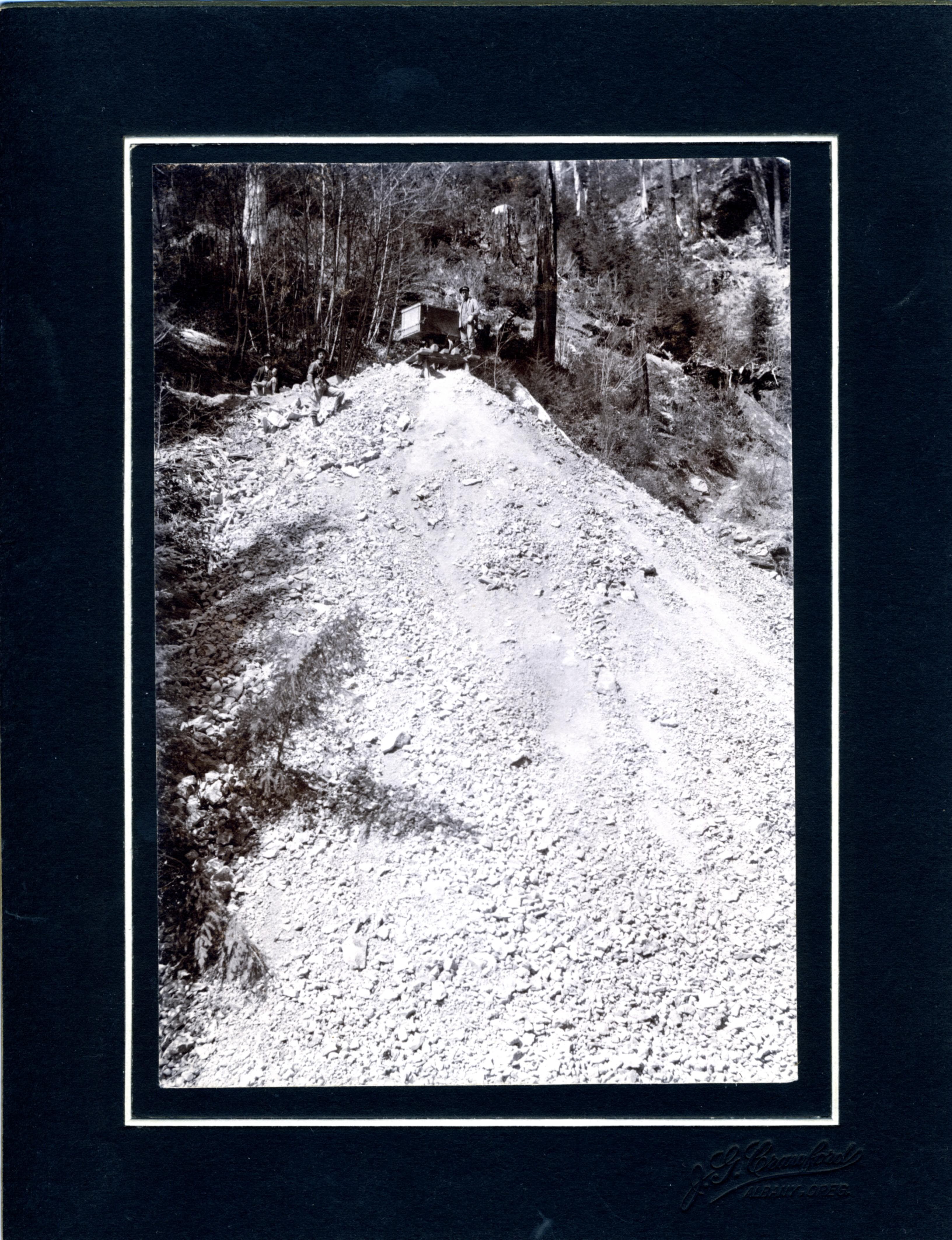 Men on a Gravel Hill (8113482246)