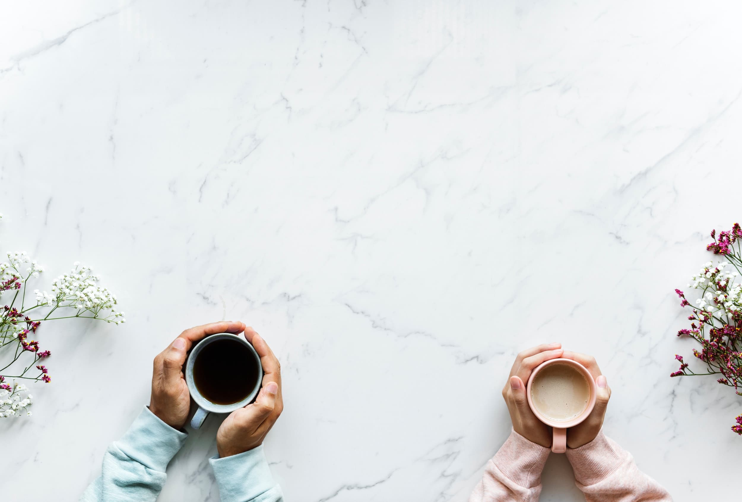 Person Holding Mug on Table (29214761648)