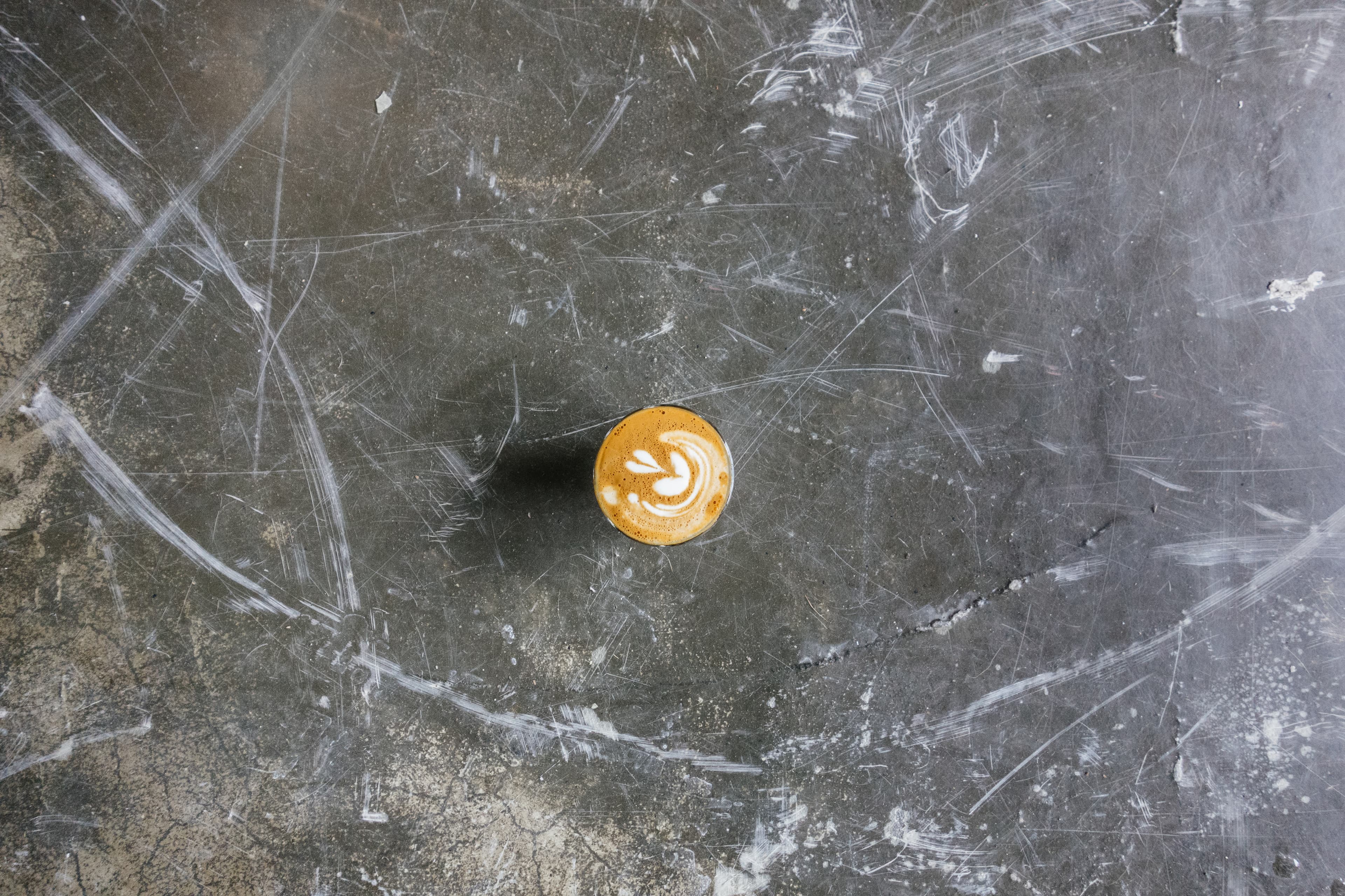 Coffee on a concrete surface (Unsplash)