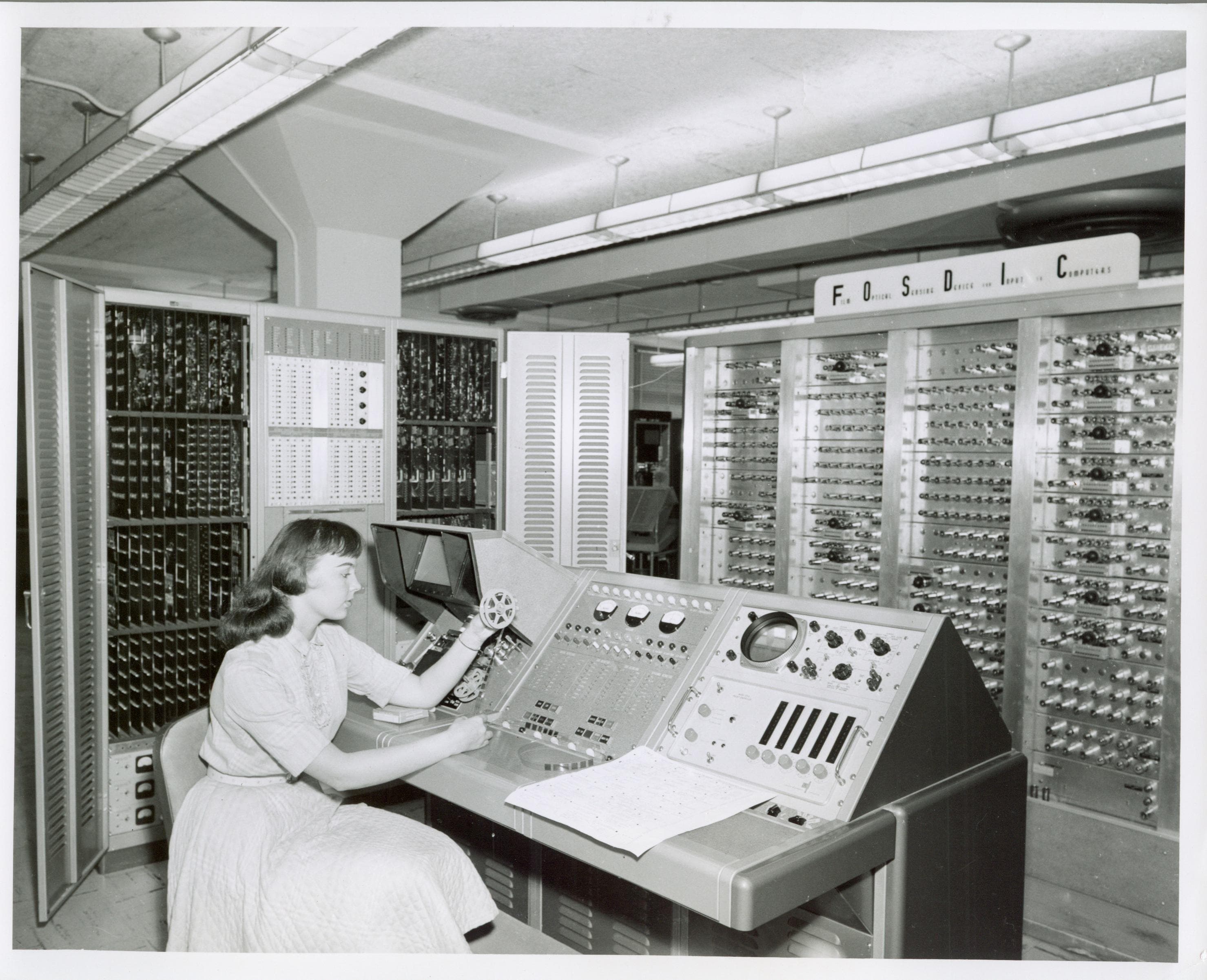Woman inspecting FOSDIC film