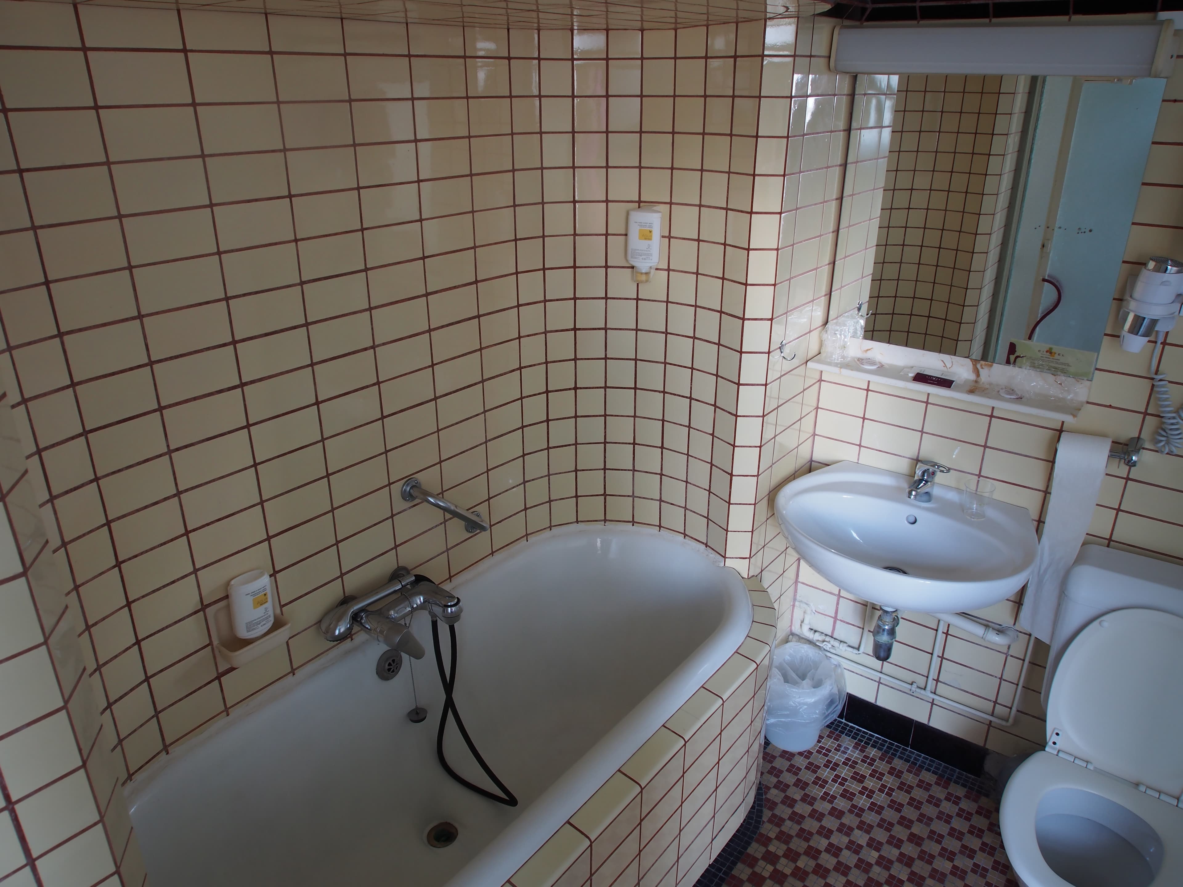 Old bathroom with subway tiles