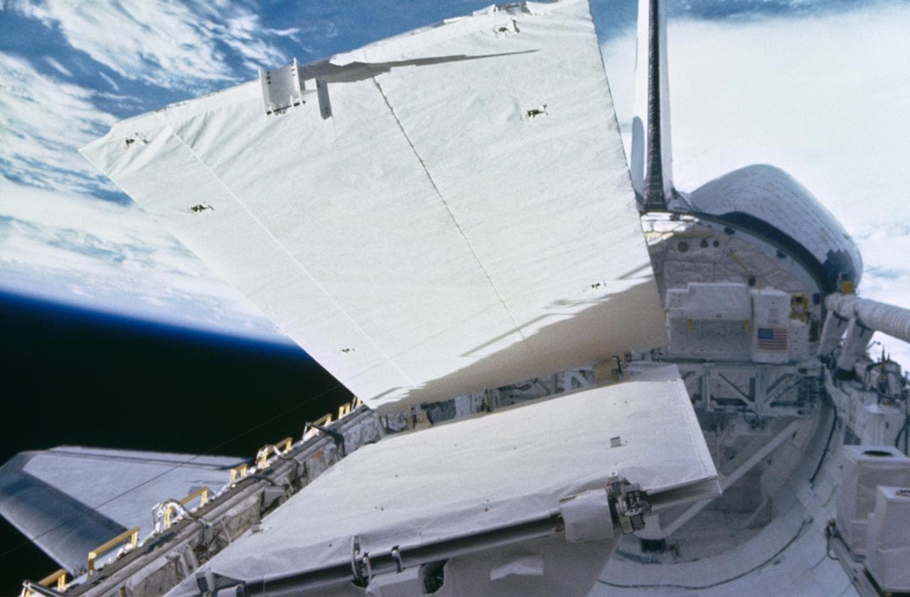 View of the SIR-B antenna being deployed during STS 41-G