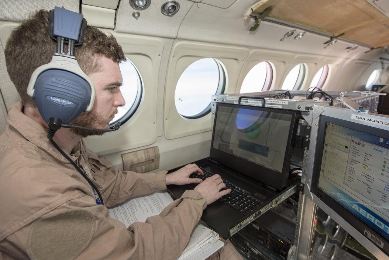 Instrument Operator Monitors Wind Data
