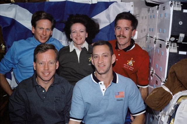 STS-104 crew in-flight portrait in the Atlantis middeck