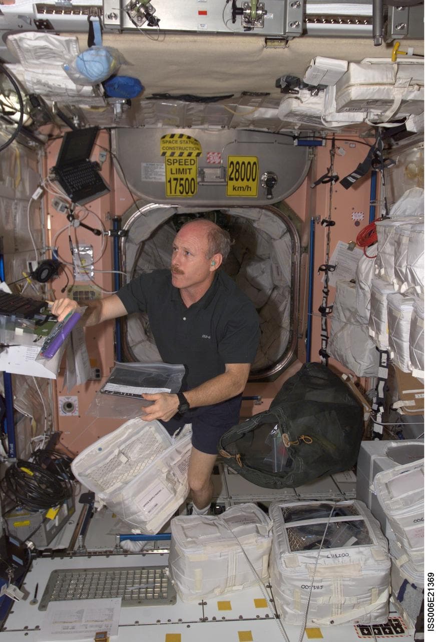 Bowersox works at a laptop computer in Node 1 during Expedition Six