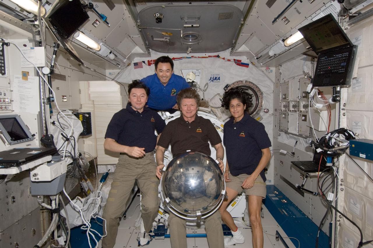 ISS032 crewmembers with Sfera satellite in JPM