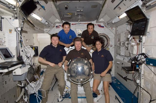 ISS032 crewmembers with Sfera satellite in JPM