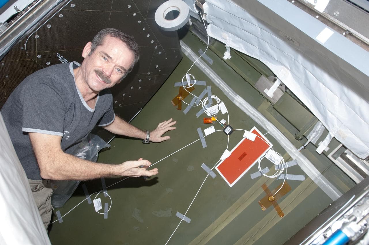 Hadfield installing UBNT Sensors in the U.S. Laboratory