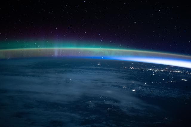 Aurora, dimly, intersects