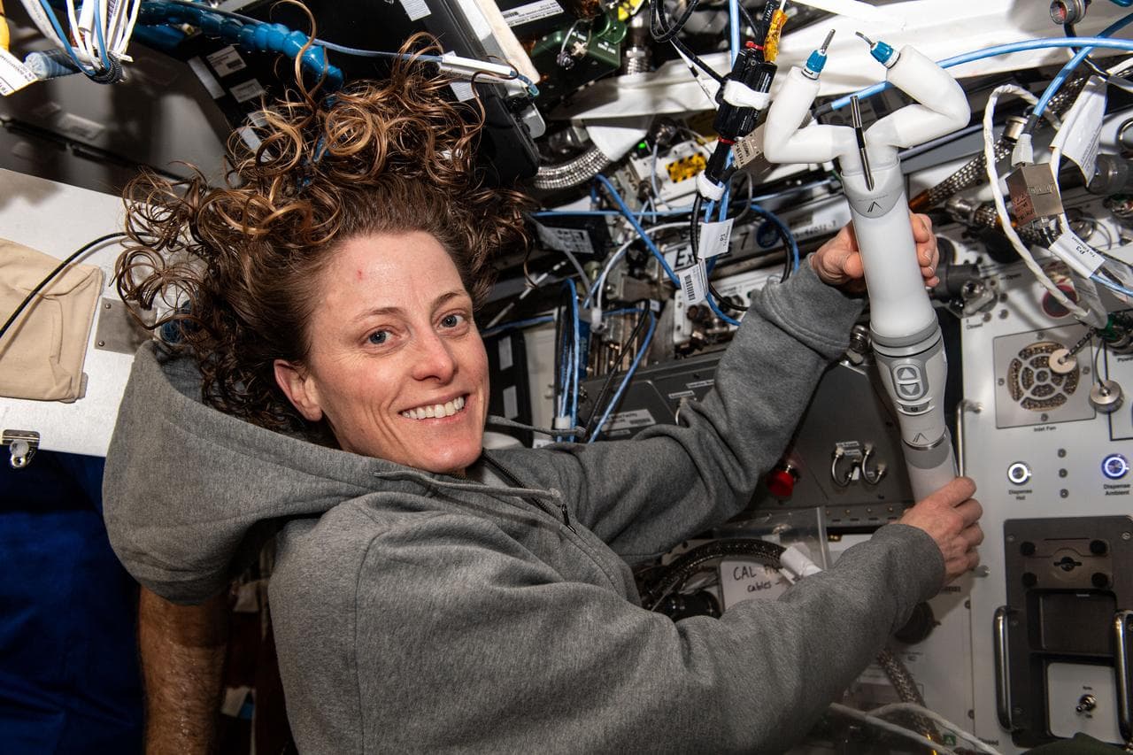 NASA Astronaut Loral O'Hara Holds Robotic Surgery Device