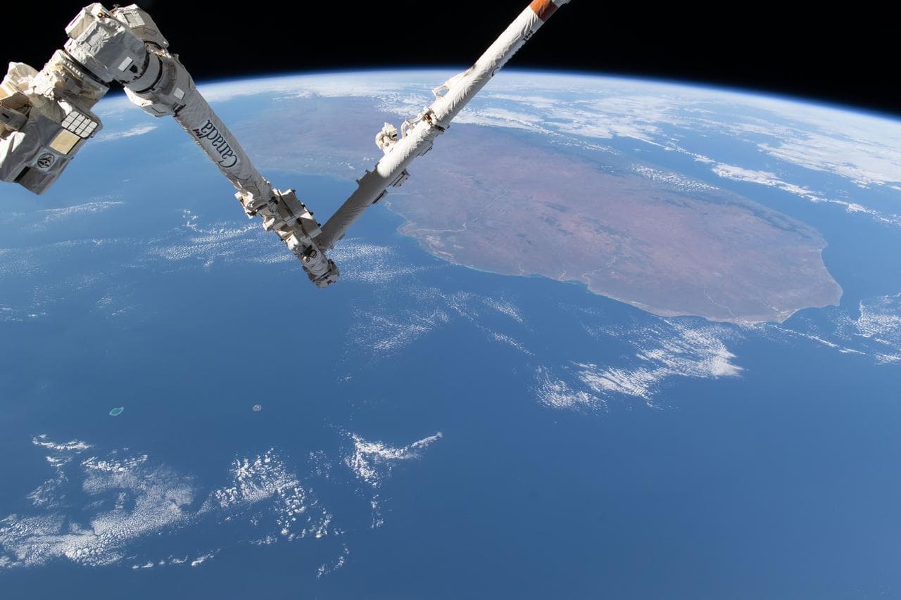 The Canadarm2 robotic arm above the Mozambique Channel