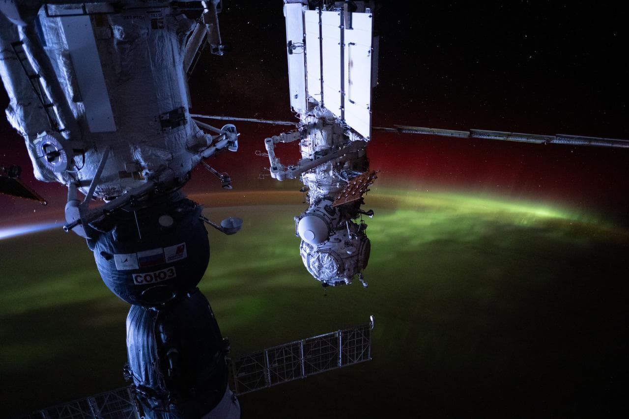 The aurora australis streams over the Earth
