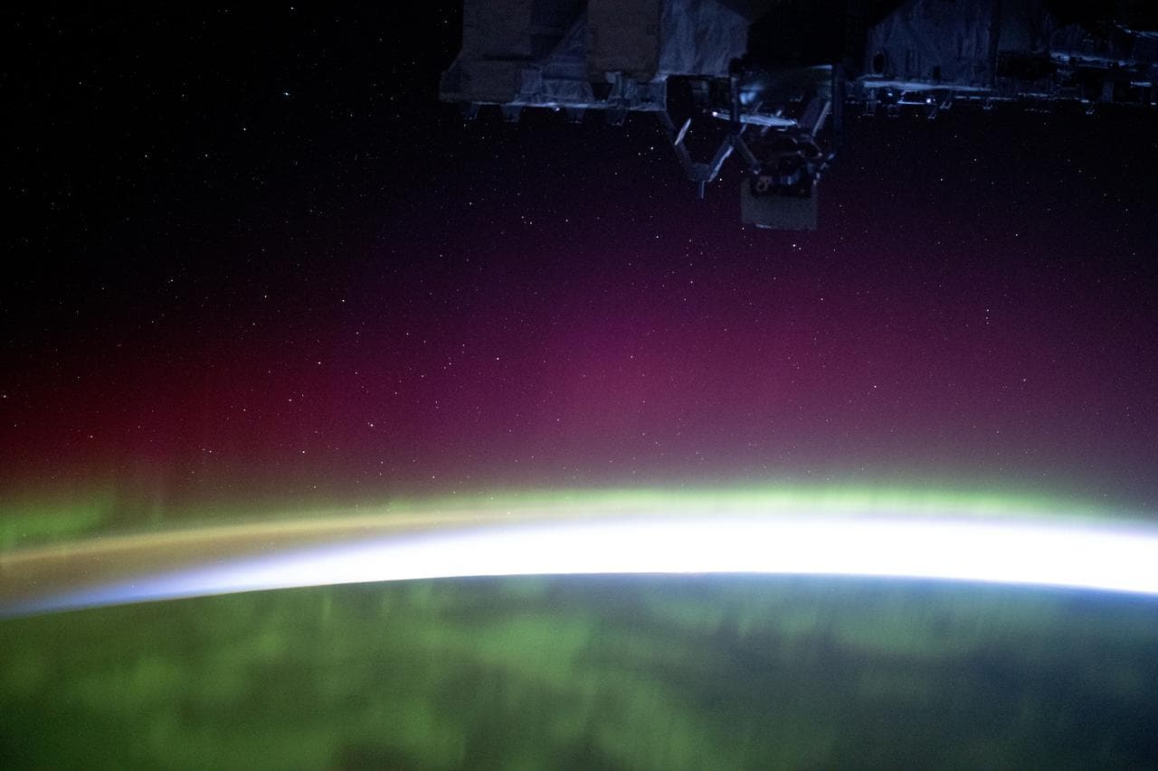 The aurora borealis blankets the Earth