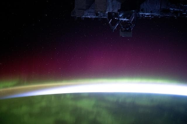 The aurora borealis blankets the Earth