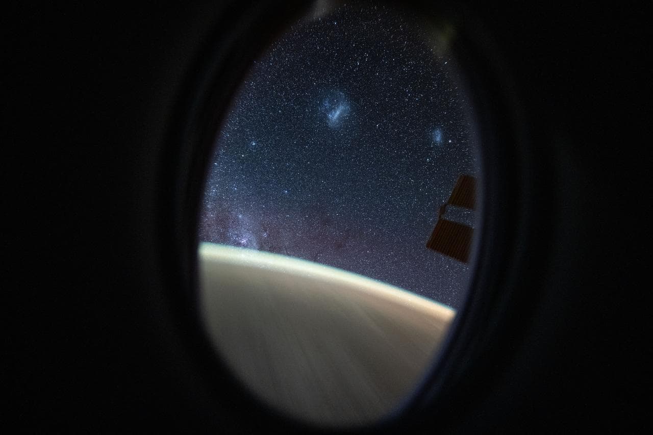 The Megallanic Clouds seen from Dragon's window