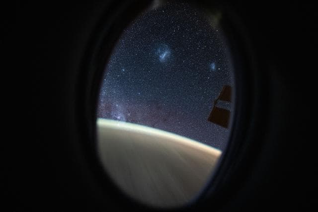 The Megallanic Clouds seen from Dragon's window