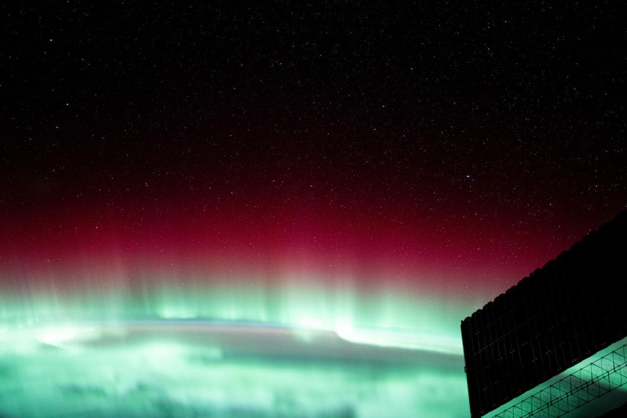 A red and green aurora borealis above Canada's Gulf of St. Lawrence