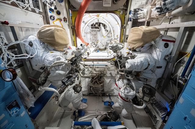 Spacesuits, staged, inside