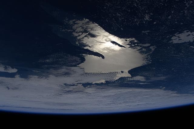 Oblique of view of the sun's glint beaming off Lake Superior