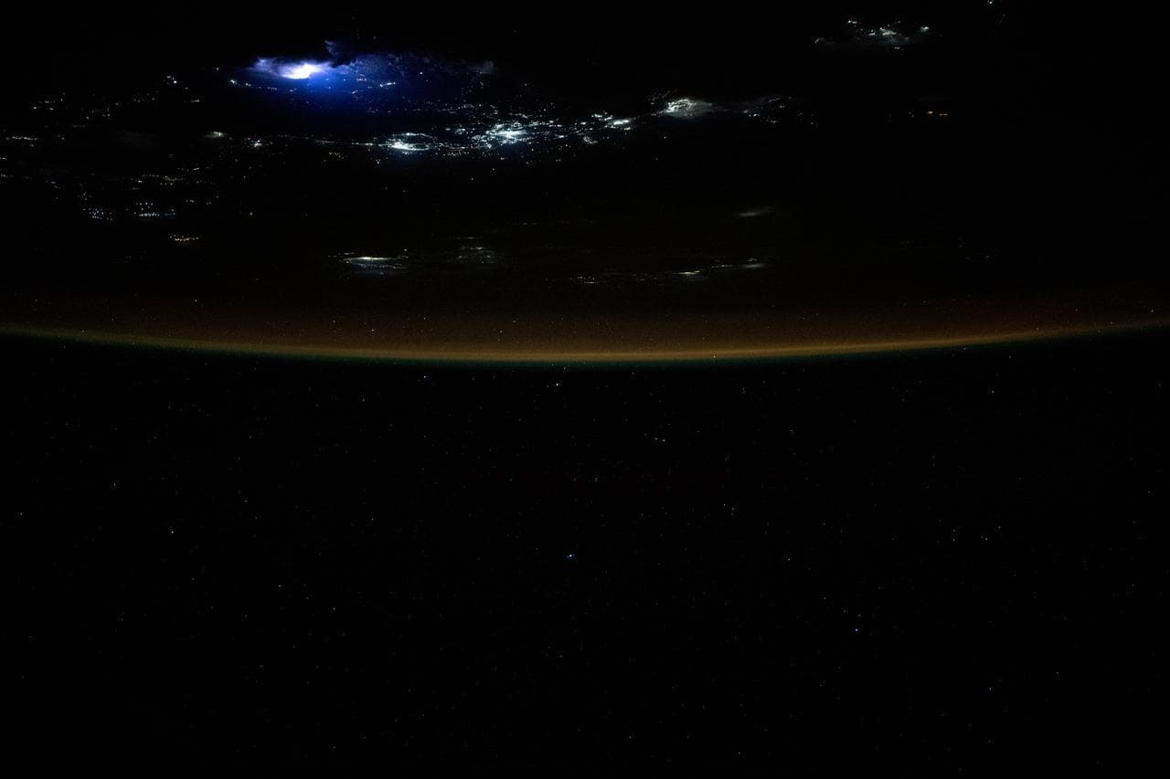 Lightning illuminates the clouds above Southeast Asia