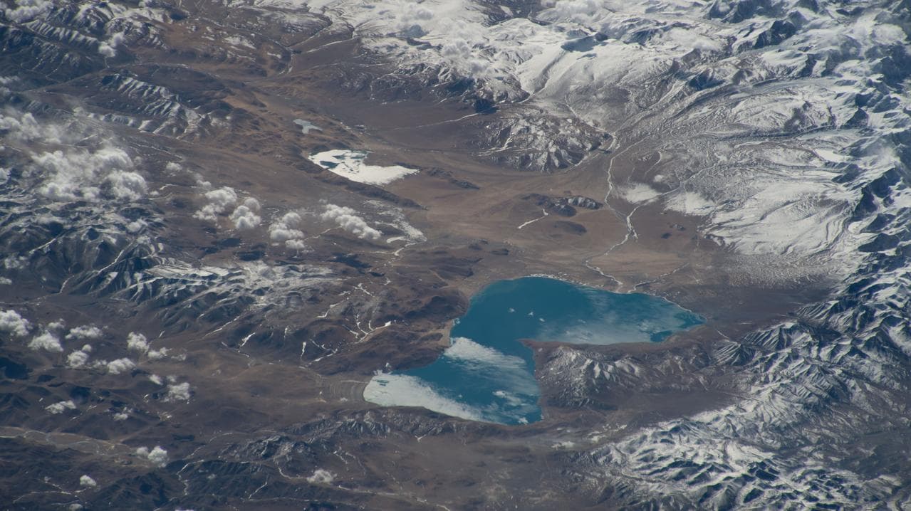 Peiku Lake in southwest China is surrounded by Himalayan peaks