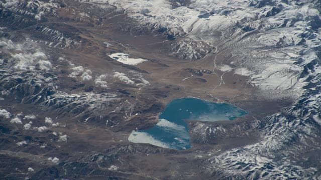 Peiku Lake in southwest China is surrounded by Himalayan peaks