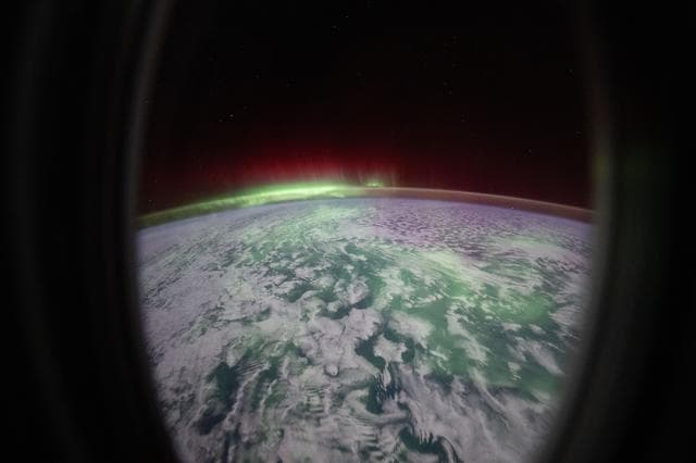 The aurora australis glows above the Indian Ocean