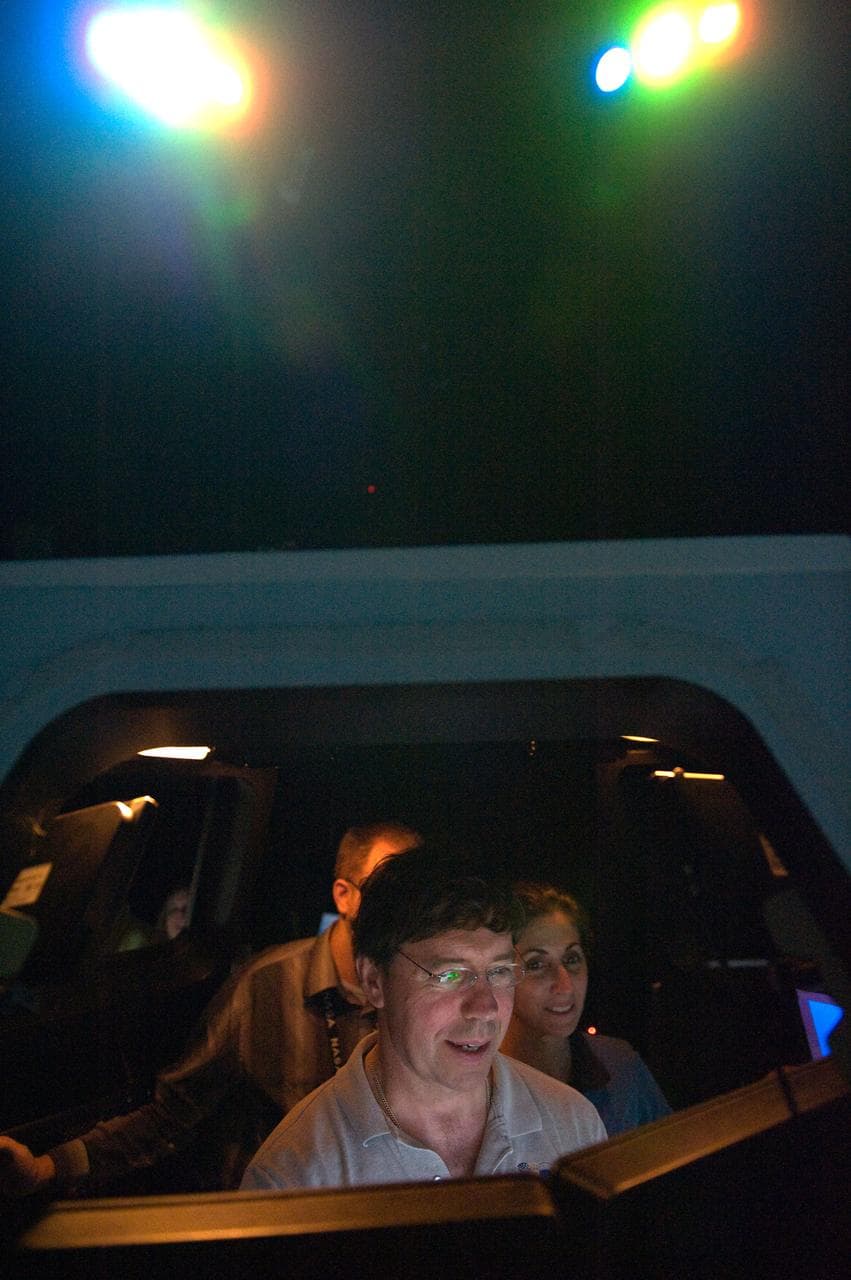 STS-133 crew members Mike Barratt and Nicole Stott in cupola