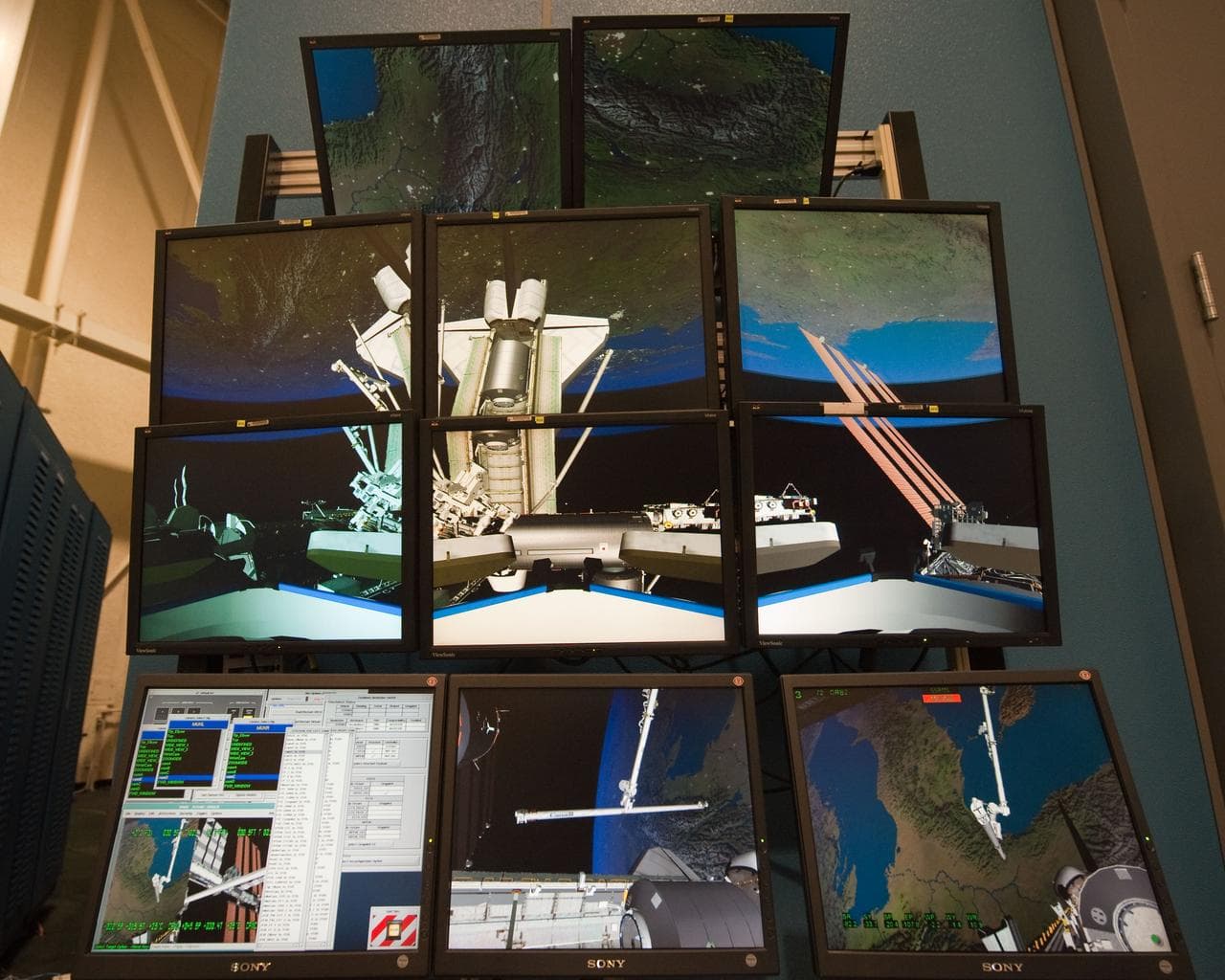 STS-133 crew members Mike Barratt and Nicole Stott in cupola