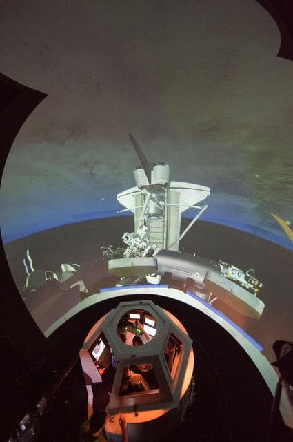 STS-133 crew members Mike Barratt and Nicole Stott in cupola