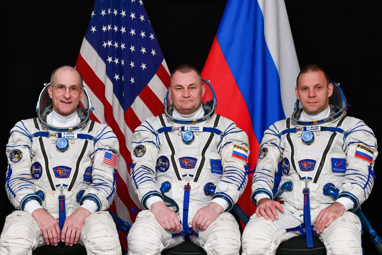 Soyuz MS-26 crew members pose for a portrait
