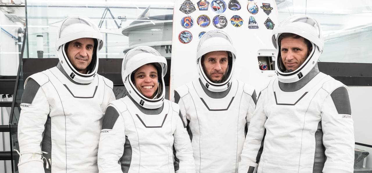 The SpaceX Crew-13 members pose for a portrait in their pressure suits
