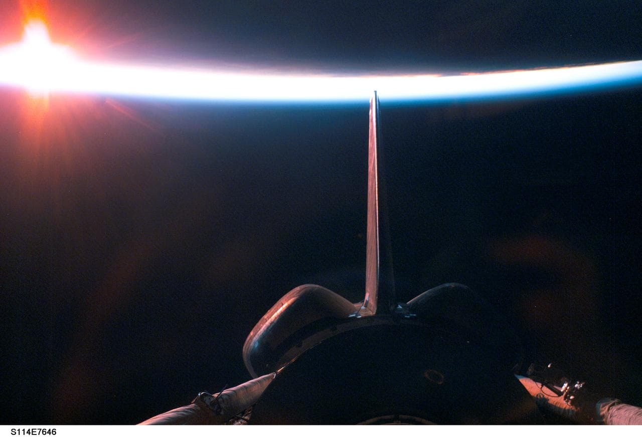 Dark sunrise over payload bay