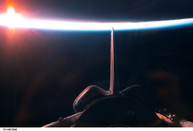 Dark sunrise over payload bay