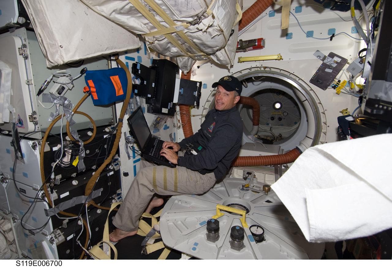 Swanson at Laptop on Middeck (MDDK)