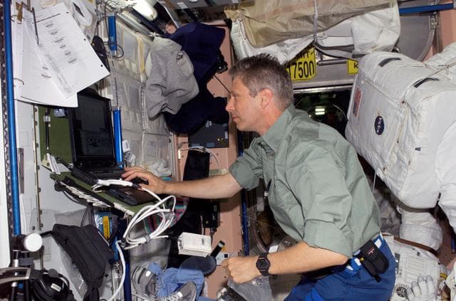 Reiter uses a computer in the Node 1 module during STS-121/Exp. 13 OPS