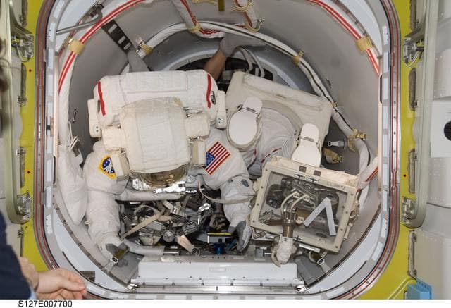 Wolf and Cassidy in the A/L during EVA-3 Preparation