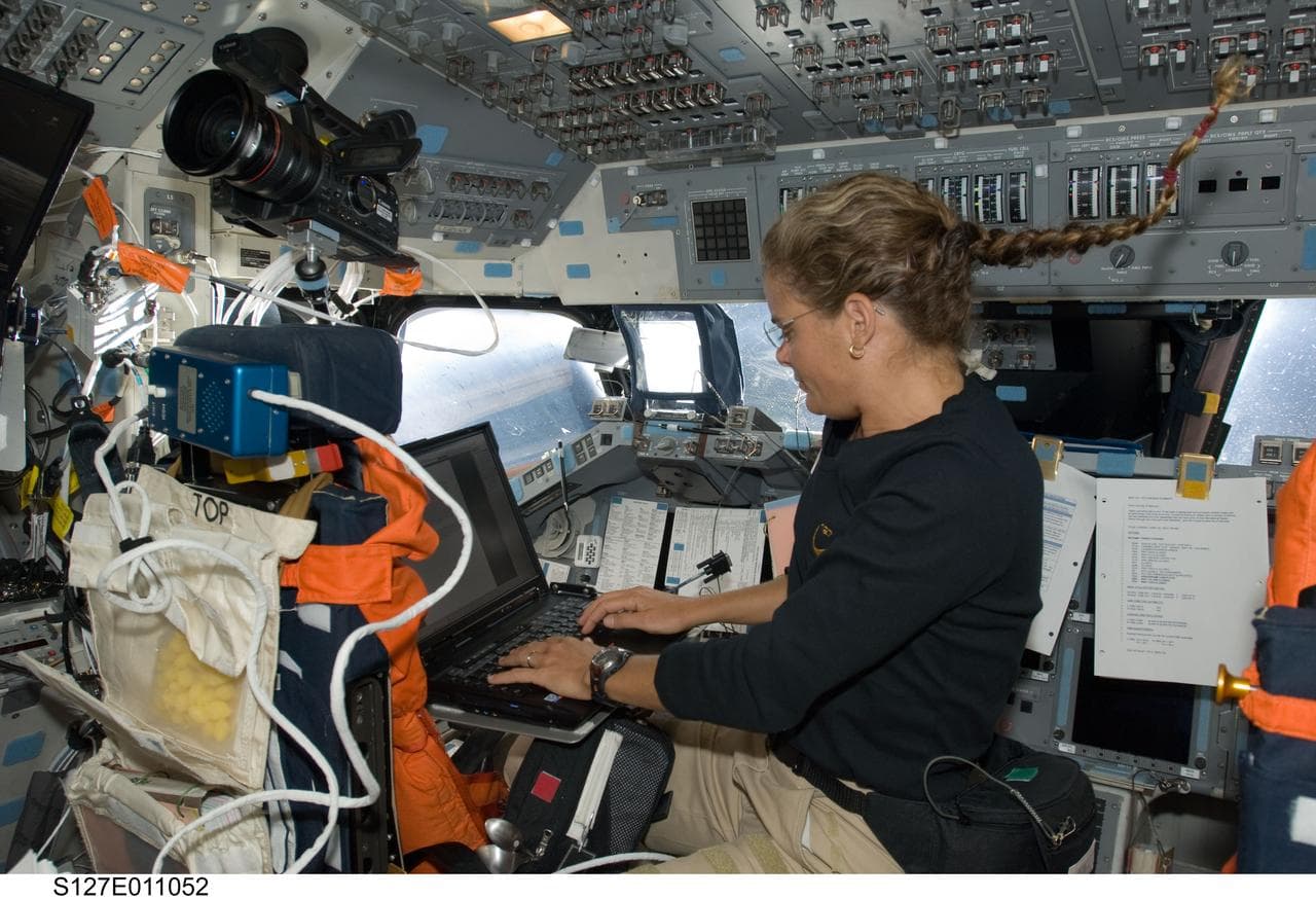 Payette uses computer in the aft FD on Space Shuttle Endeavour