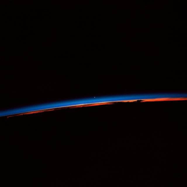 STS-30 sunset with Venus near the center of the frame