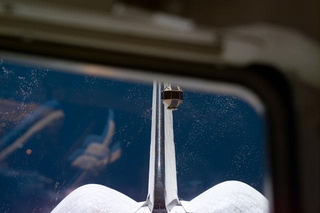 PANSAT satellite deployment from STS-95 Discovery's payload bay