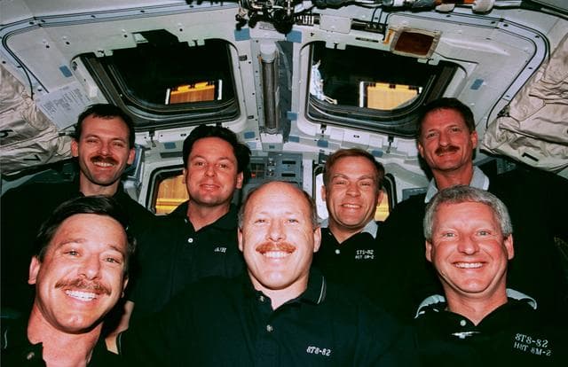 Crew portrait in the orbiter flight deck