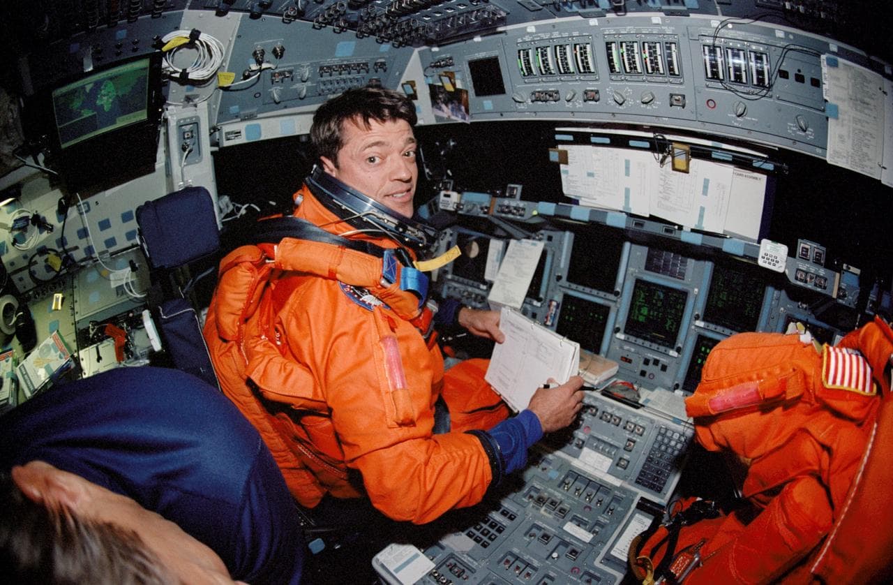 Fish-eye view of STS-112 CDR Ashby on forward flight deck