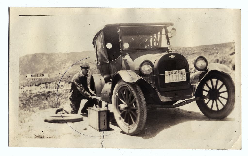 Fixin' a flat. Chevrolet 490 Touring car 1922